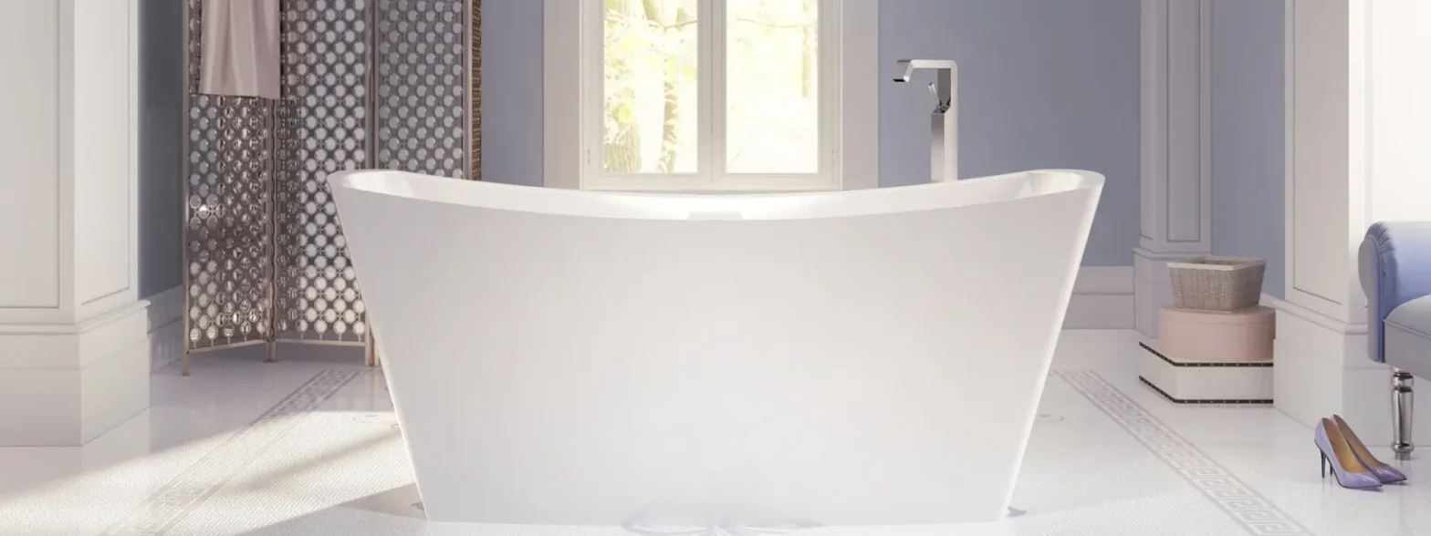 White freestanding bathtub as a centerpiece in a bright, elegant bathroom with a decorative screen and pale blue walls.